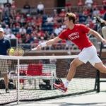 College tennis leaping shot goes viral despite net violation