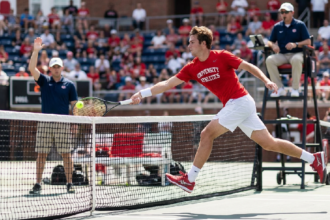 College tennis leaping shot goes viral despite net violation